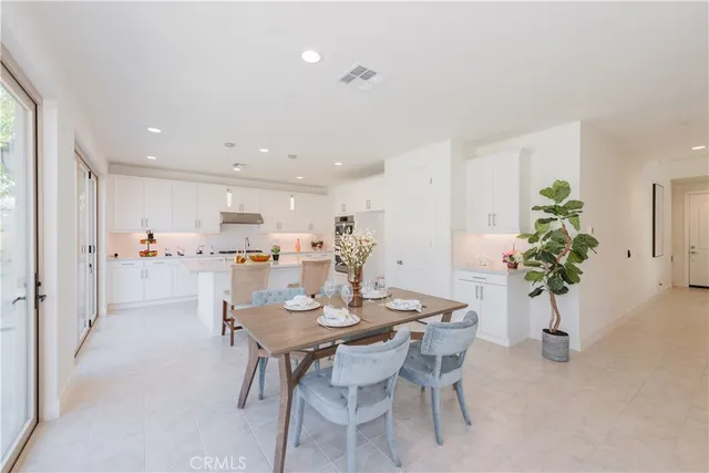 a kitchen with sink attached with living room