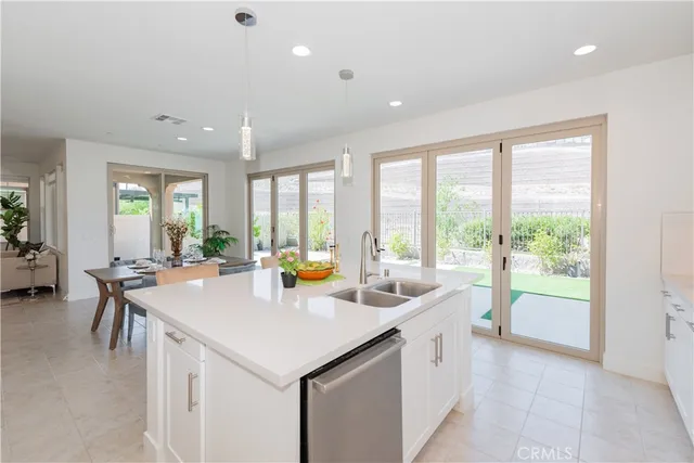 a view of a hallway with staircase and white walls