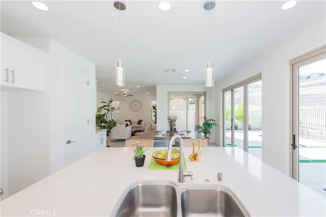 a bathroom with a sink mirror vanity and toilet