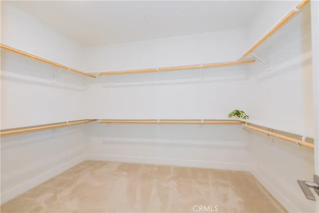 a spacious bathroom with a tub sink and mirror