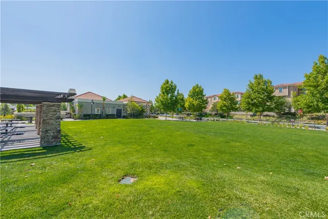 a view of a chairs and table in patio