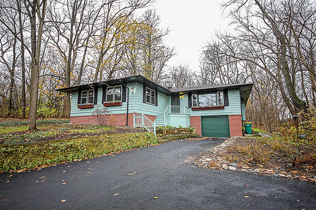S436 Winfield Road Winfield, IL 60190 - Photo 1 of 23 a front view of a house with a yard and garage