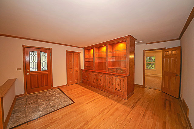 S436 Winfield Road Winfield, IL 60190 - Photo 6 of 23 a bedroom with a bed and wooden floor