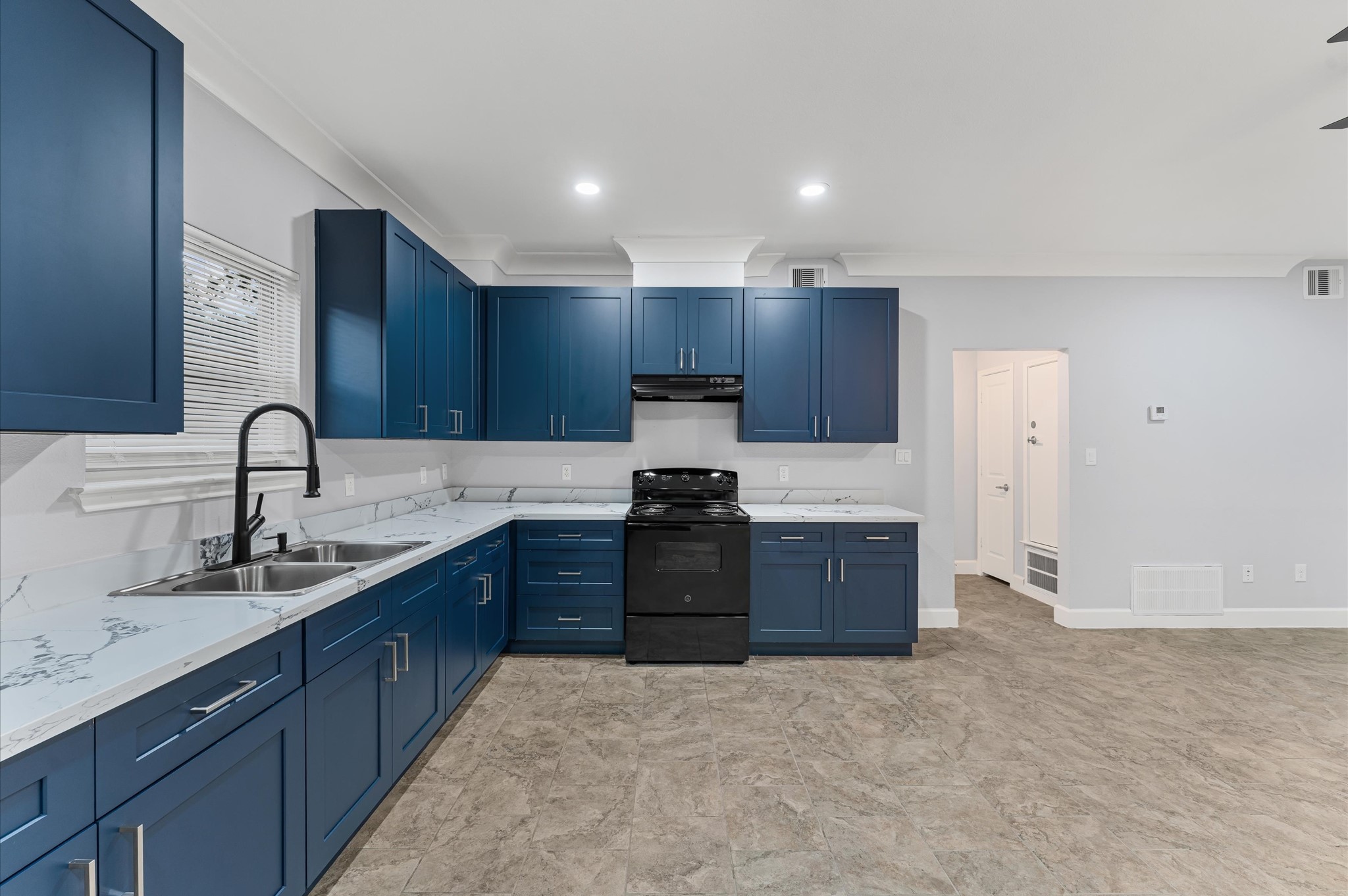 8221 Brockton Street Houston, TX 77017 - Photo 25 of 32 a kitchen with stainless steel appliances granite countertop a stove a sink and a refrigerator