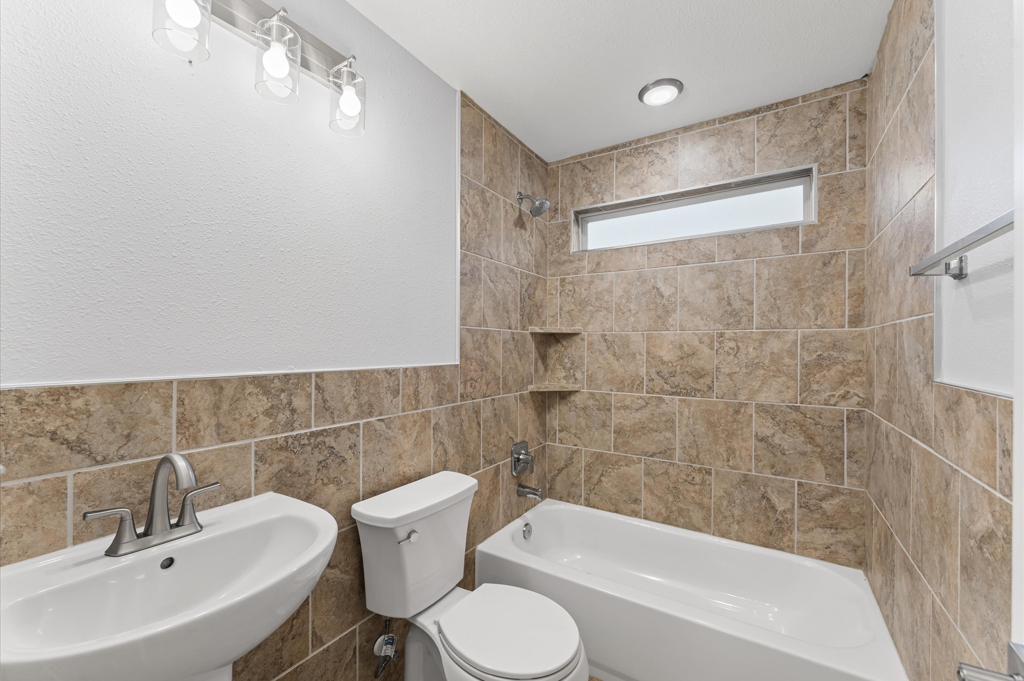 8221 Brockton Street Houston, TX 77017 - Photo 27 of 32 a bathroom with a sink toilet and shower