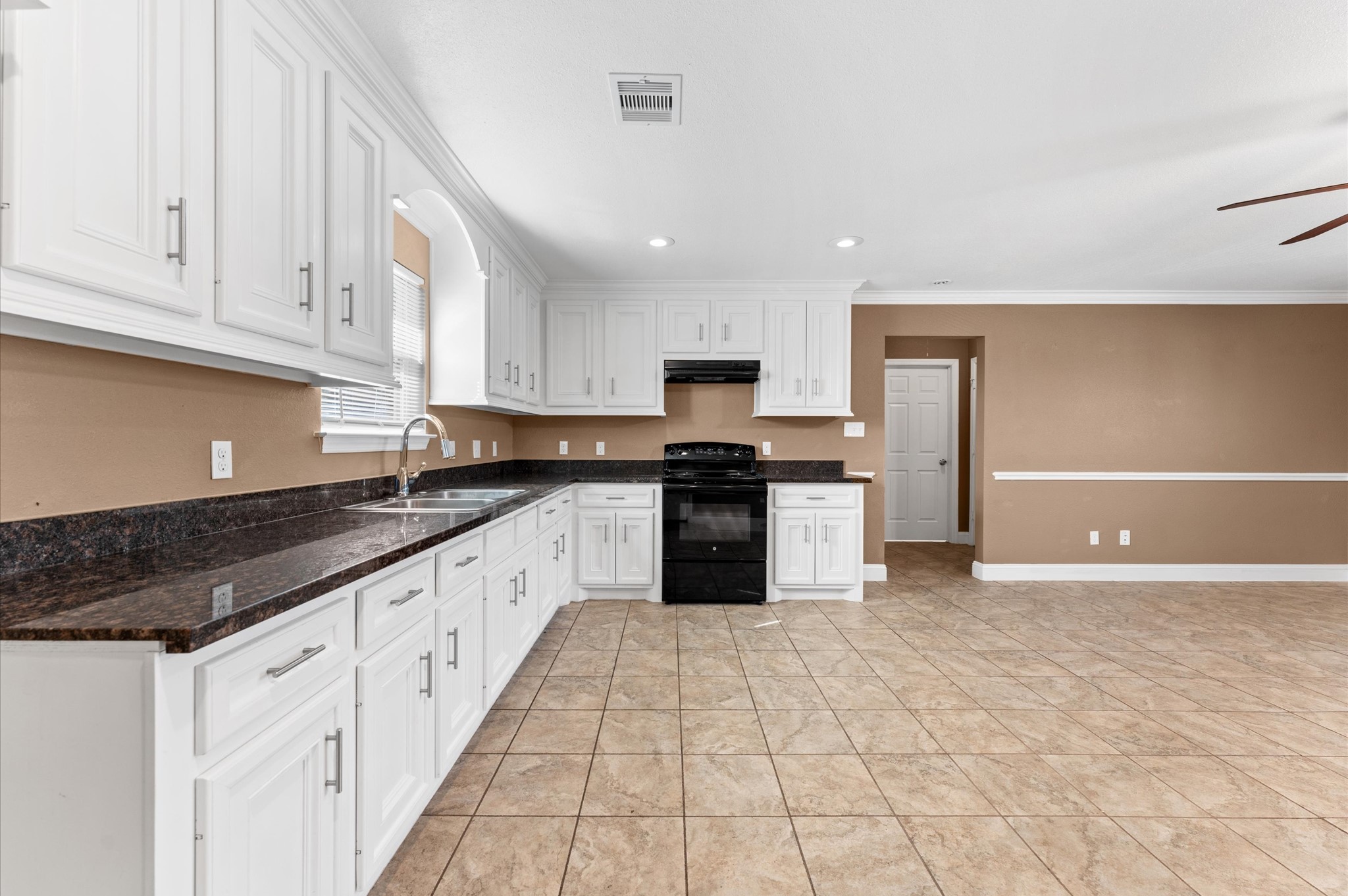8221 Brockton Street Houston, TX 77017 - Photo 10 of 32 a large kitchen with granite countertop a stove a sink dishwasher and a refrigerator with wooden floor