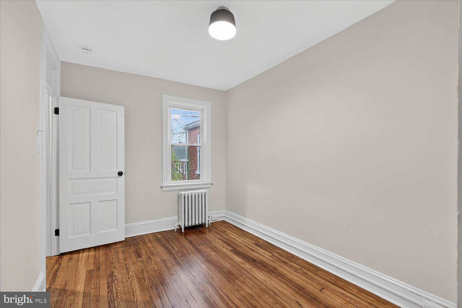 718 High Street Lancaster, PA 17603 - Photo 16 of 33 a view of empty room with wooden floor and fan