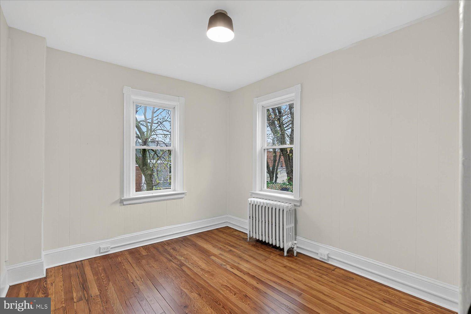 718 High Street Lancaster, PA 17603 - Photo 18 of 33 an empty room with wooden floor and windows