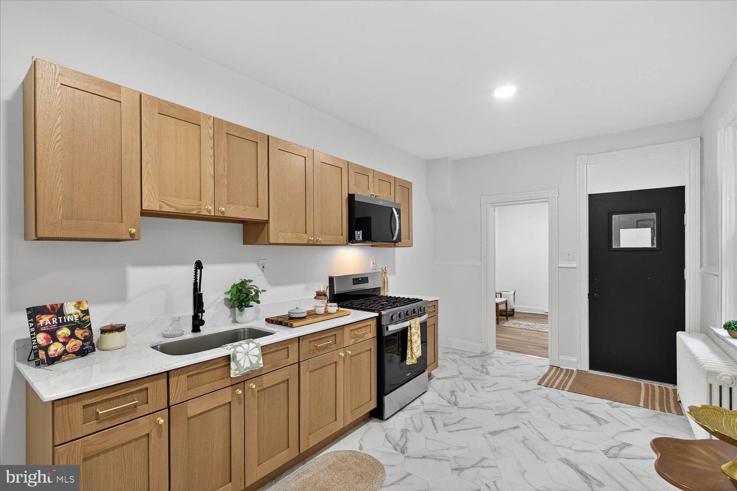 718 High Street Lancaster, PA 17603 - Photo 5 of 33 a kitchen with stainless steel appliances granite countertop a sink stove and cabinets