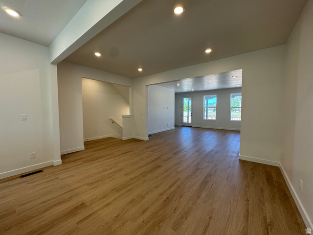 1472 North 1875 West, Unit 151 Layton, UT 84041 - Photo 6 of 20 Expansive room featuring wood-finish flooring, recessed lighting, and white baseboards