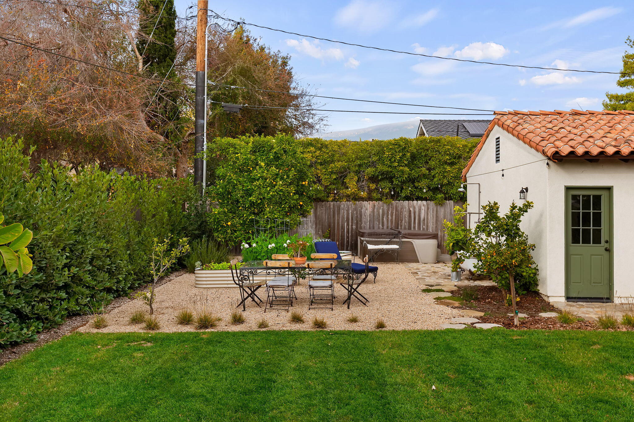 3020 Puesta Del Sol Santa Barbara, CA 93105 - Photo 24 of 33 a backyard of a house with table and chairs