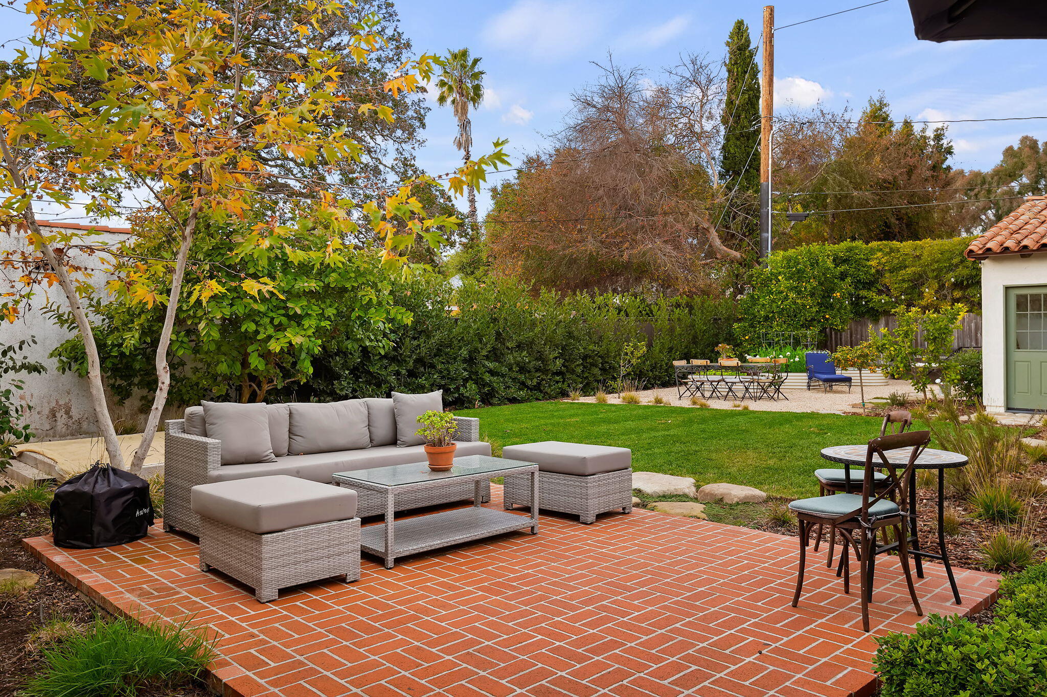 3020 Puesta Del Sol Santa Barbara, CA 93105 - Photo 31 of 33 a view of a patio with couches and a table and chairs with garden view
