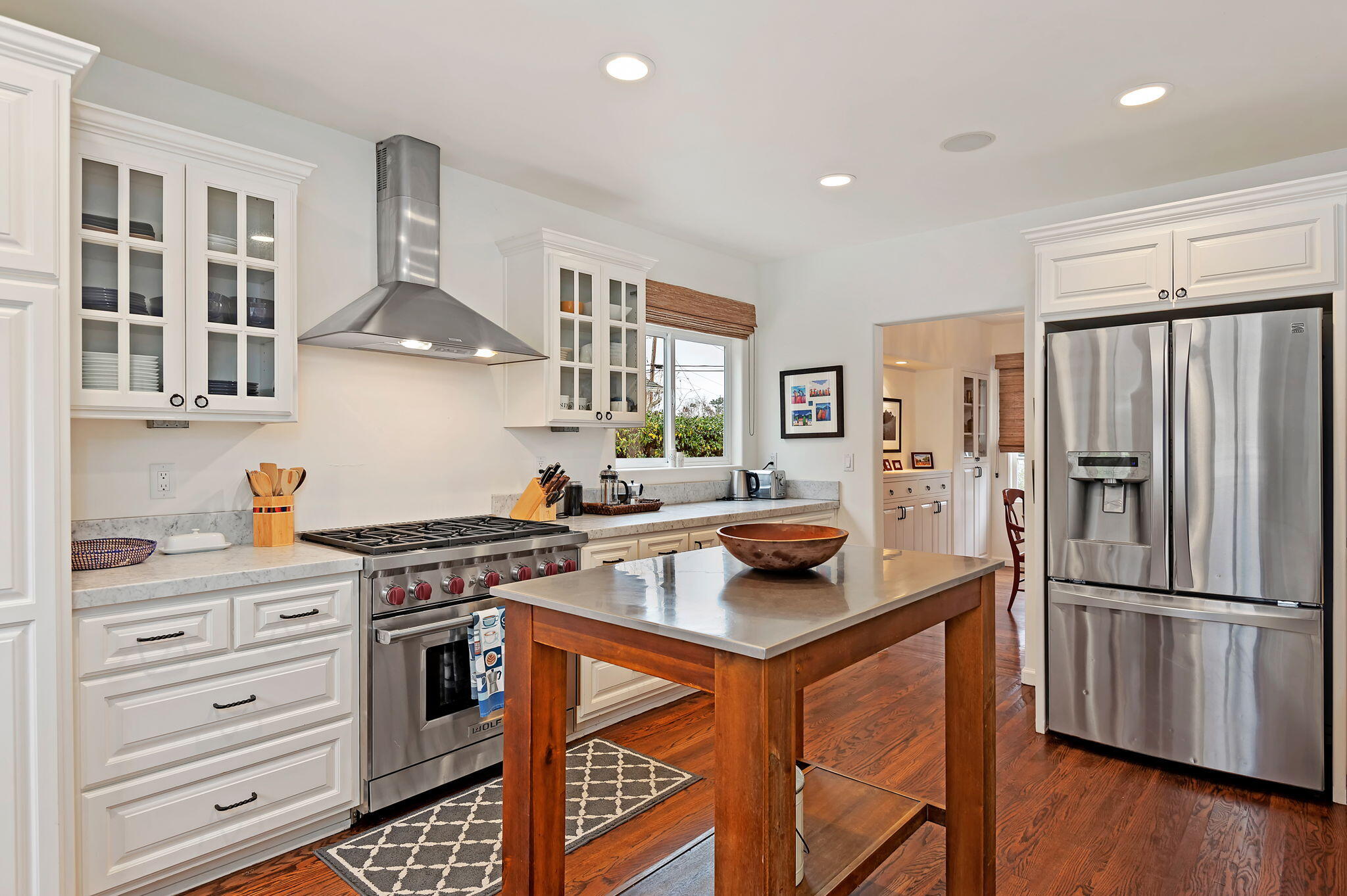3020 Puesta Del Sol Santa Barbara, CA 93105 - Photo 7 of 33 a kitchen with stainless steel appliances a stove a refrigerator and cabinets