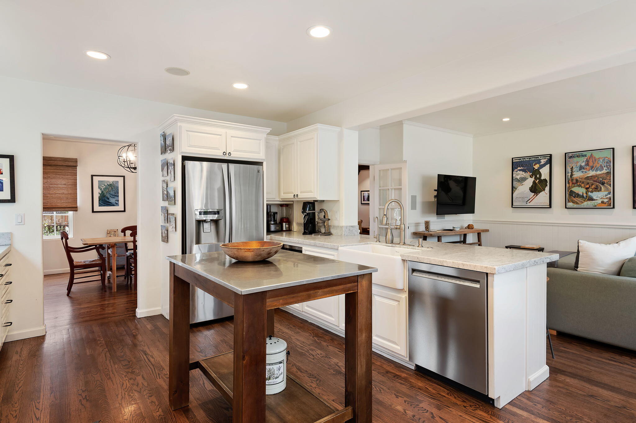 3020 Puesta Del Sol Santa Barbara, CA 93105 - Photo 9 of 33 a kitchen with stainless steel appliances kitchen island granite countertop a stove a sink a refrigerator and white cabinets with wooden floor