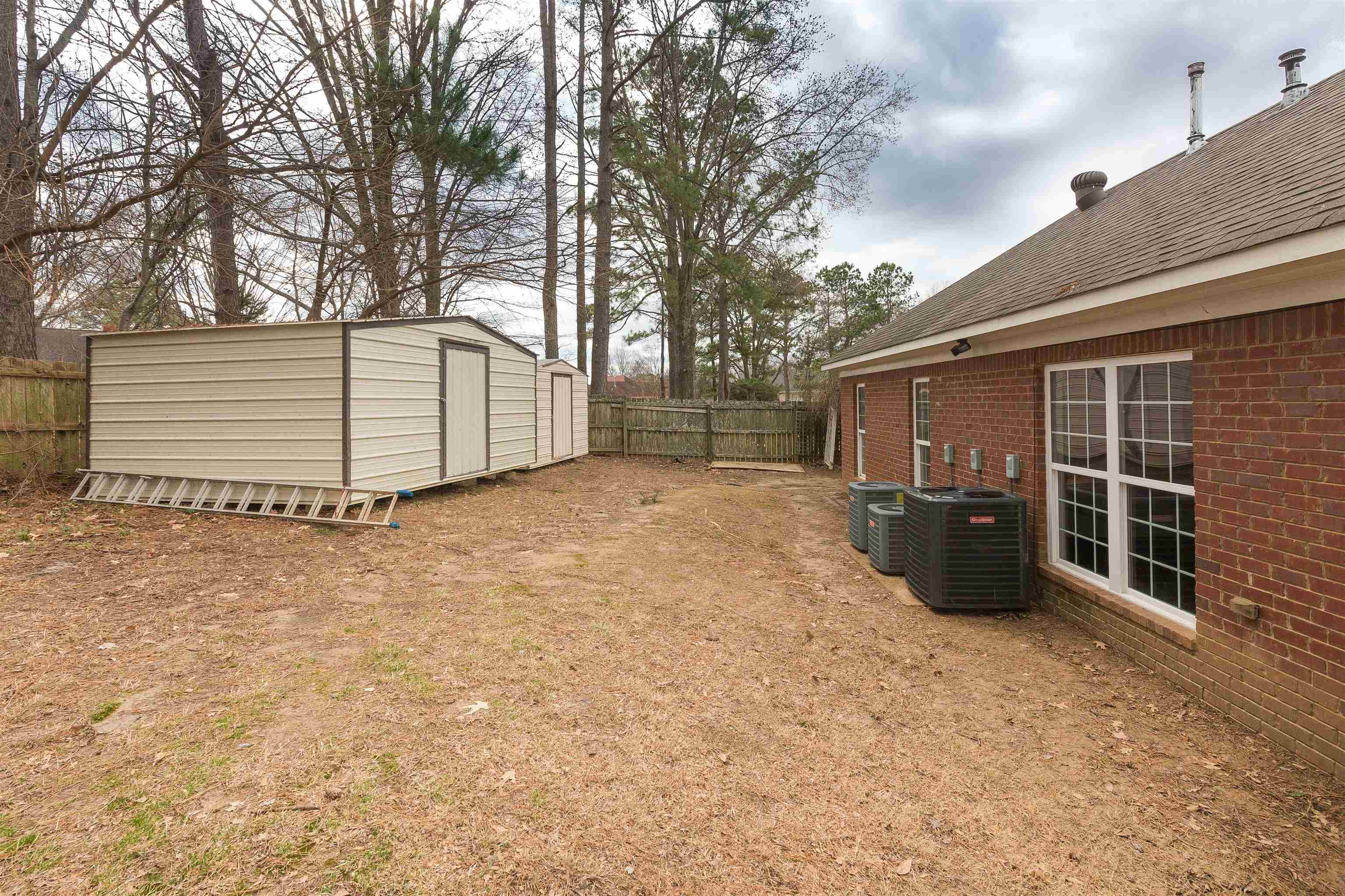 8485 Buckhurst Road Memphis, TN 38016 - Photo 24 of 25 Backyard has two large storage buildings