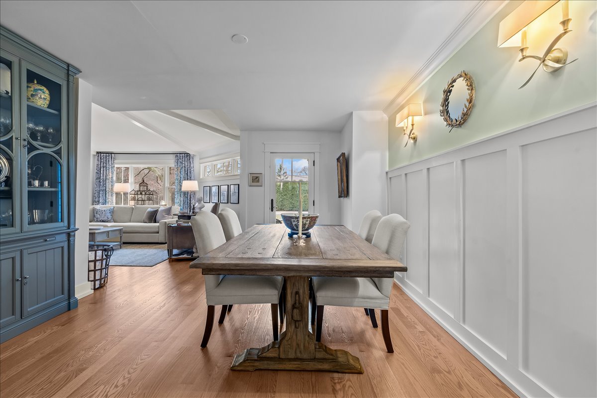 140 West Old Elm Road Lake Forest, IL 60045 - Photo 11 of 38 a view of a dining room with furniture and wooden floor