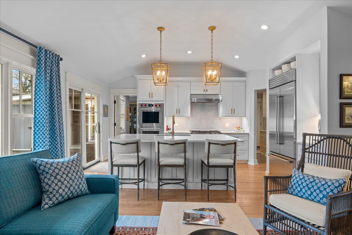 140 West Old Elm Road Lake Forest, IL 60045 - Photo 13 of 38 a kitchen with stainless steel appliances kitchen island granite countertop a table chairs and a living room