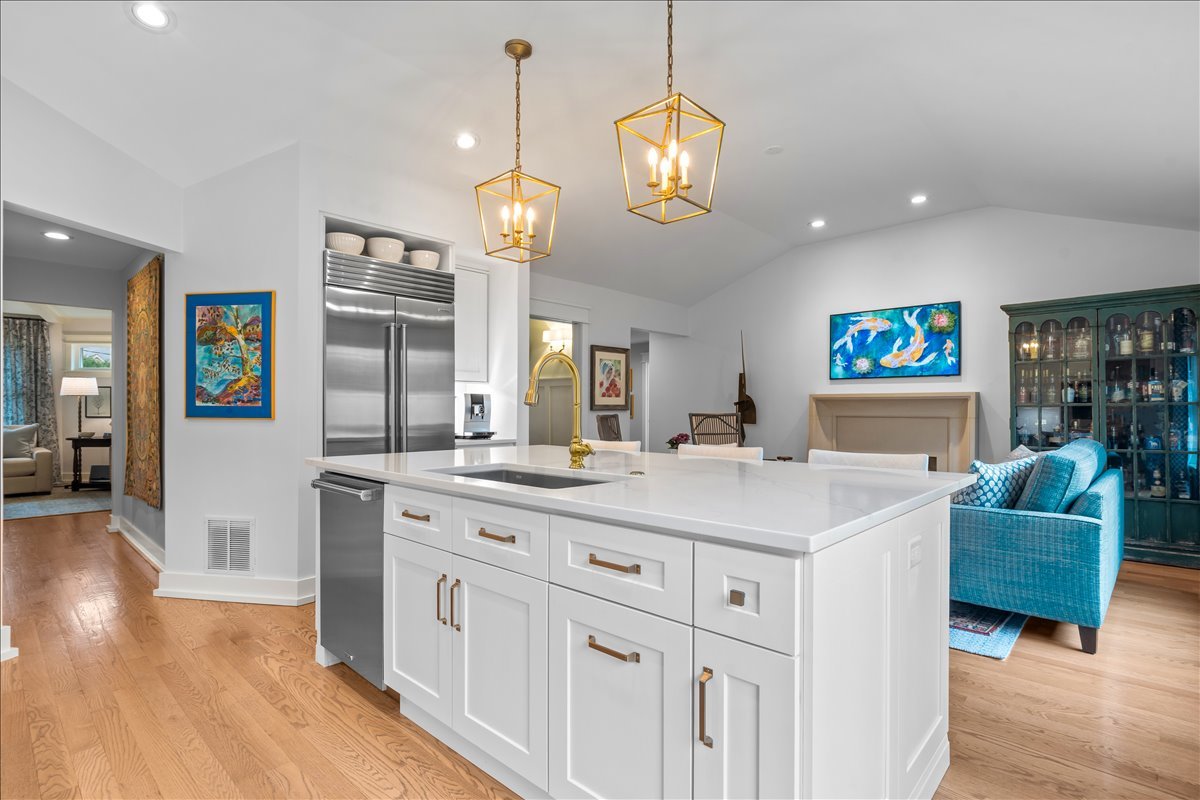 140 West Old Elm Road Lake Forest, IL 60045 - Photo 16 of 38 a view of living room kitchen island stainless steel appliances furniture a flat screen tv and wooden floor