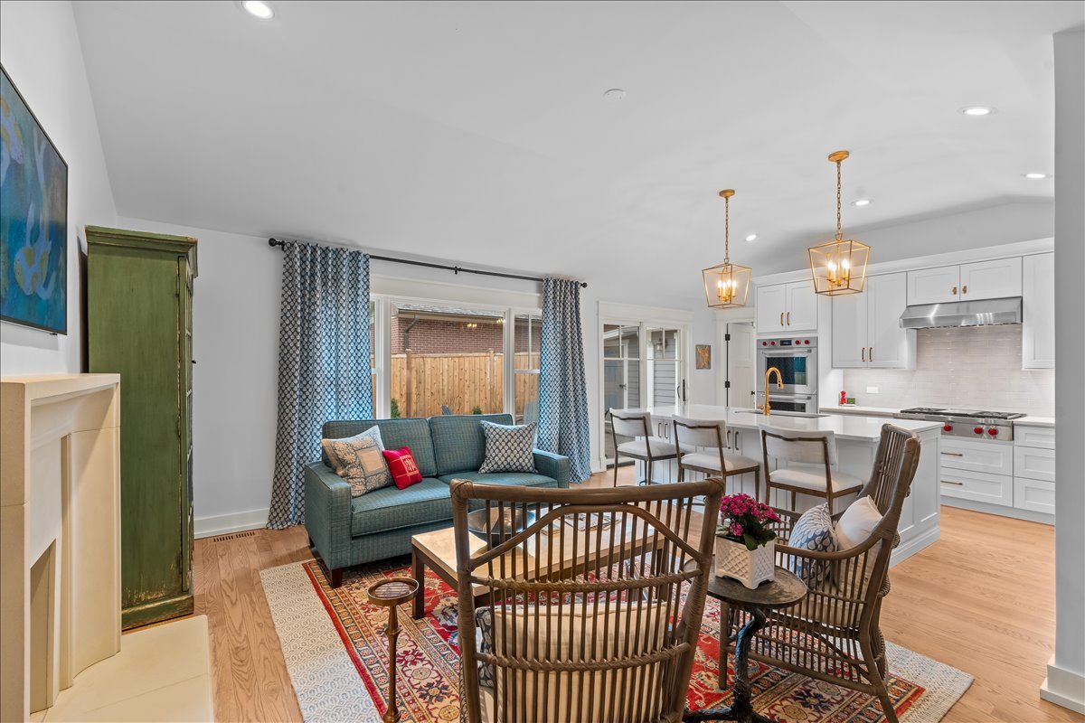 140 West Old Elm Road Lake Forest, IL 60045 - Photo 18 of 38 a living room with furniture and a chandelier