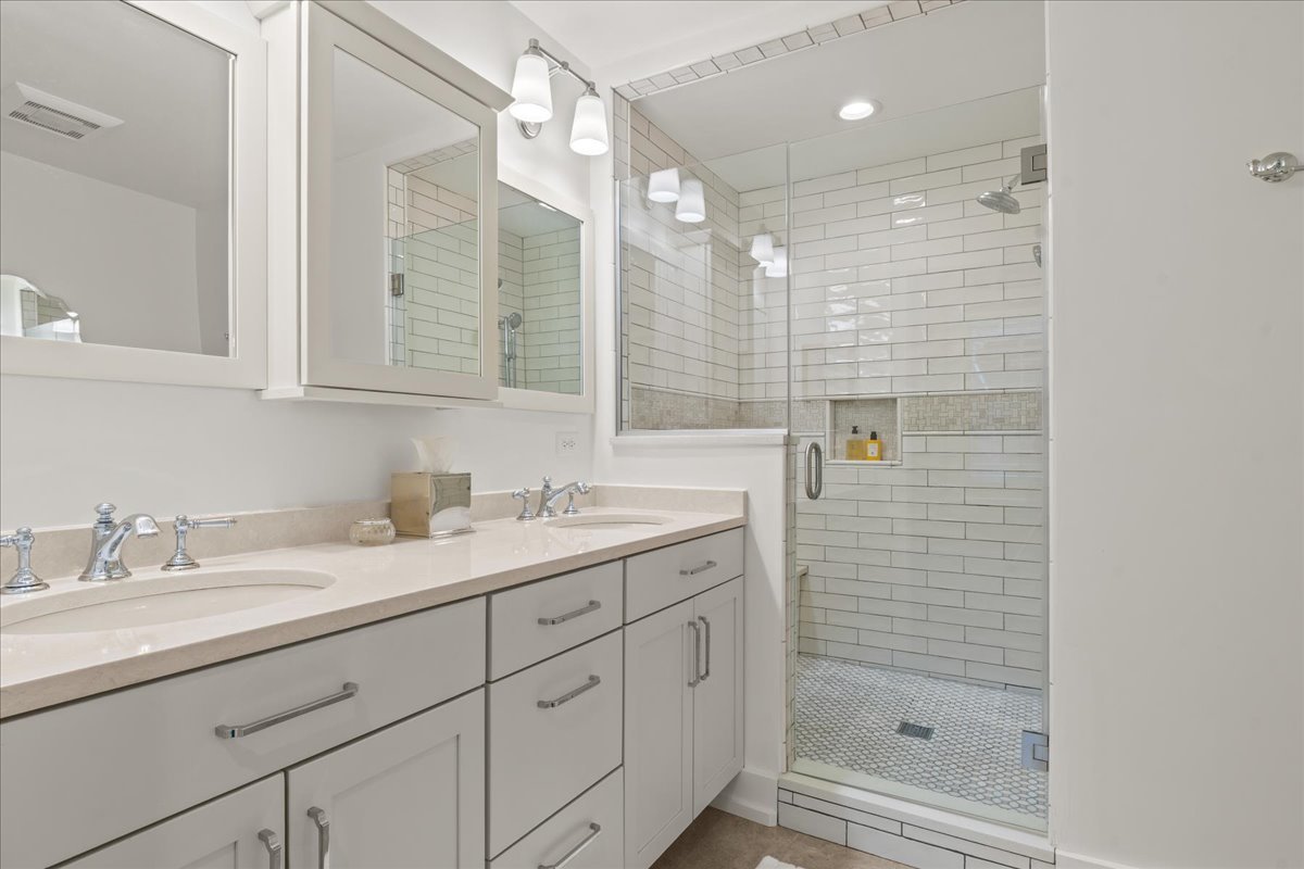 140 West Old Elm Road Lake Forest, IL 60045 - Photo 27 of 38 a bathroom with a shower sink and mirror