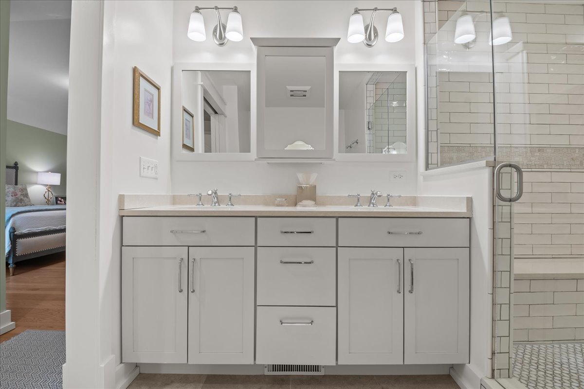 140 West Old Elm Road Lake Forest, IL 60045 - Photo 28 of 38 a bathroom with a sink vanity and mirror