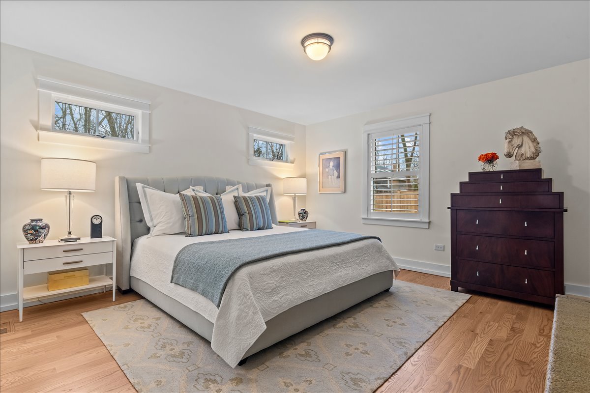 140 West Old Elm Road Lake Forest, IL 60045 - Photo 29 of 38 a bedroom with a bed and a window