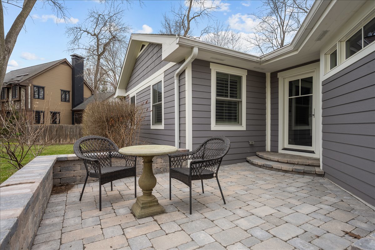 140 West Old Elm Road Lake Forest, IL 60045 - Photo 34 of 38 a view of backyard with a table and chairs and a barbeque