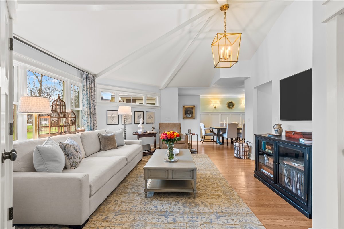 140 West Old Elm Road Lake Forest, IL 60045 - Photo 7 of 38 a living room with furniture and a flat screen tv