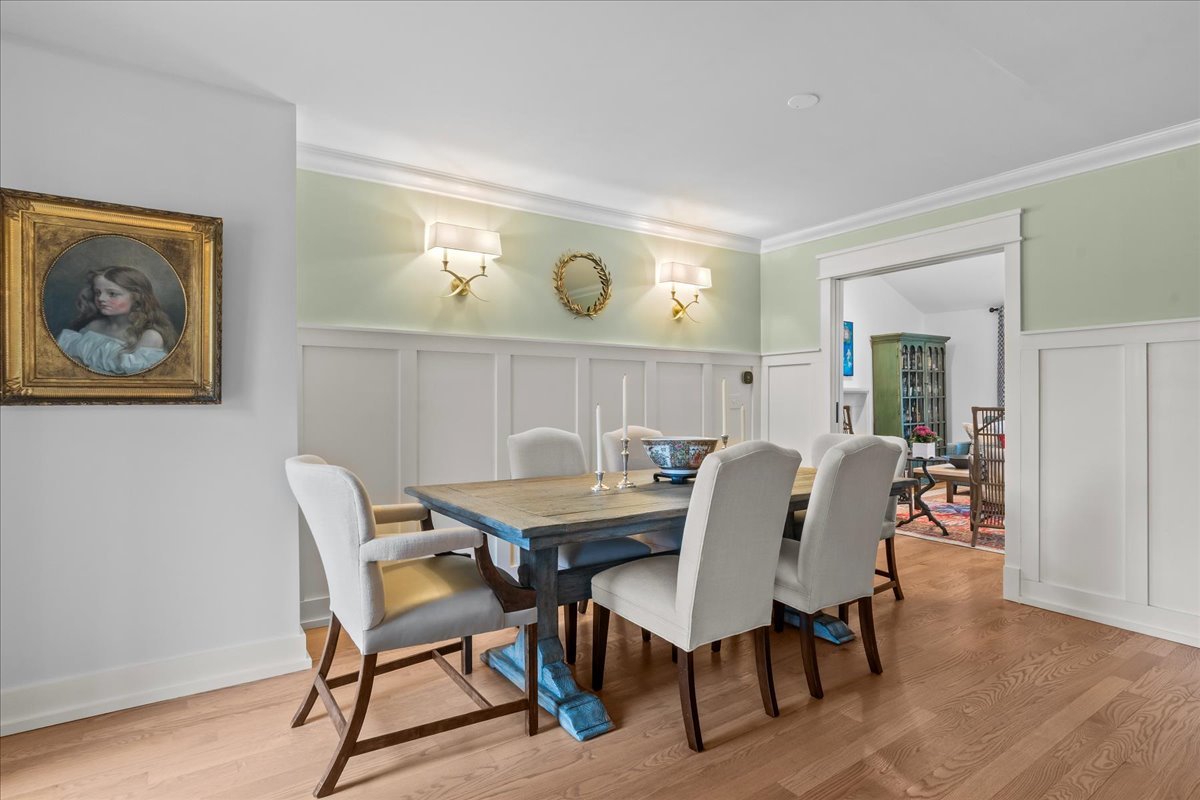 140 West Old Elm Road Lake Forest, IL 60045 - Photo 9 of 38 a view of a dining room with furniture and wooden floor