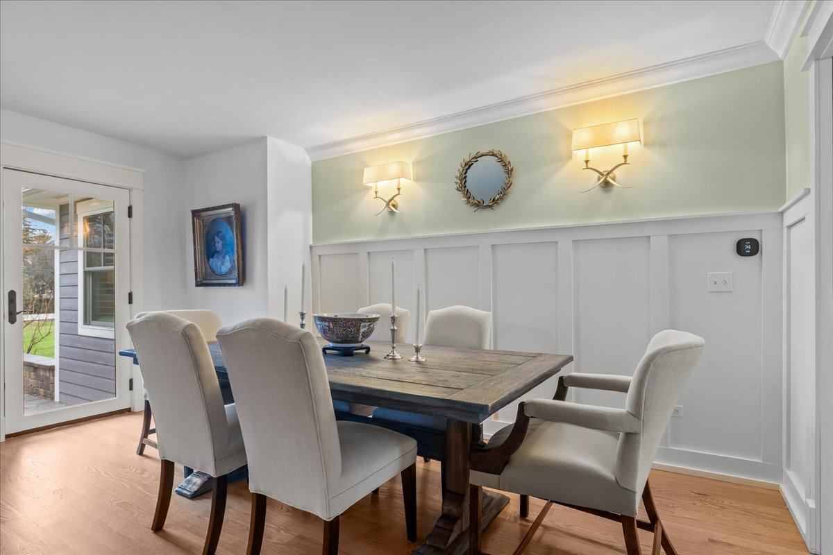 140 West Old Elm Road Lake Forest, IL 60045 - Photo 10 of 38 a view of a dining room with furniture and wooden floor