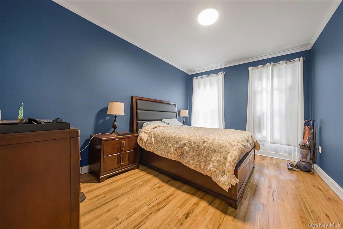 137 West 142nd Street, Unit 4A Manhattan, NY 10030 - Photo 10 of 24 Bedroom featuring crown molding and light wood finished floors