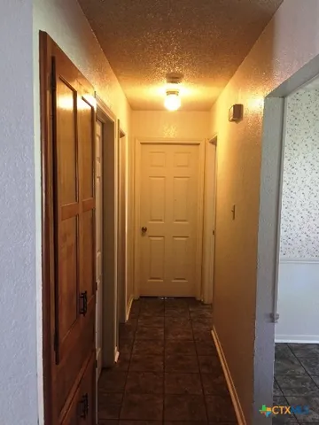 a bathroom with a glass door shower