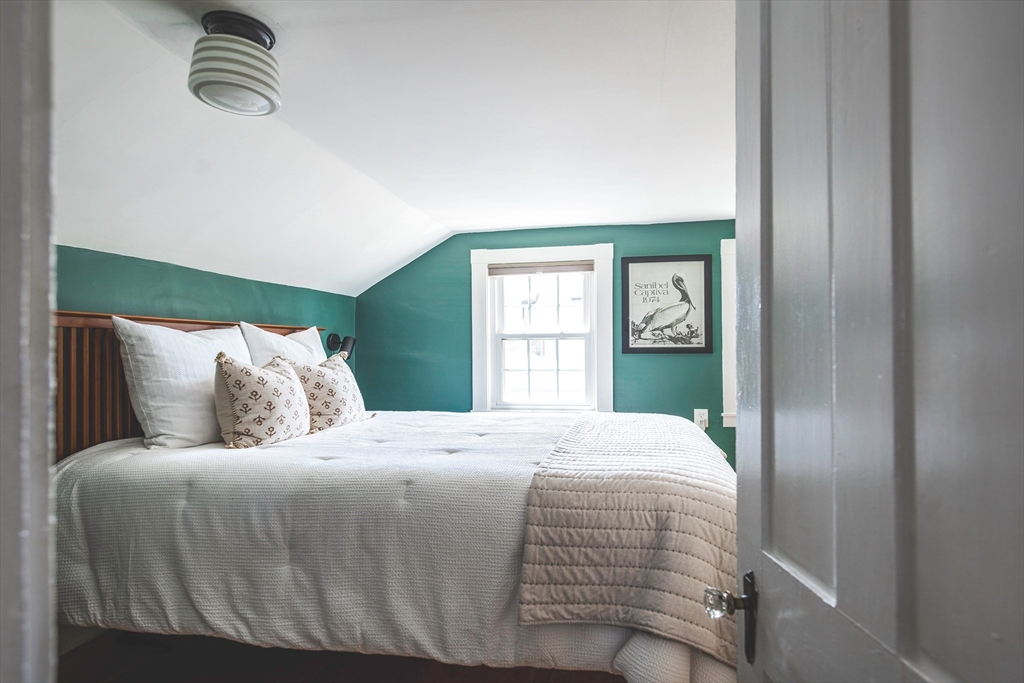 30 Paradise Road Swampscott, MA 01907 - Photo 15 of 24 a bedroom with a balcony a bed and window