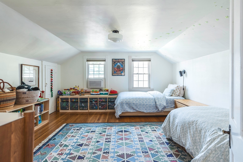 30 Paradise Road Swampscott, MA 01907 - Photo 16 of 24 a bedroom with two beds and a lamp
