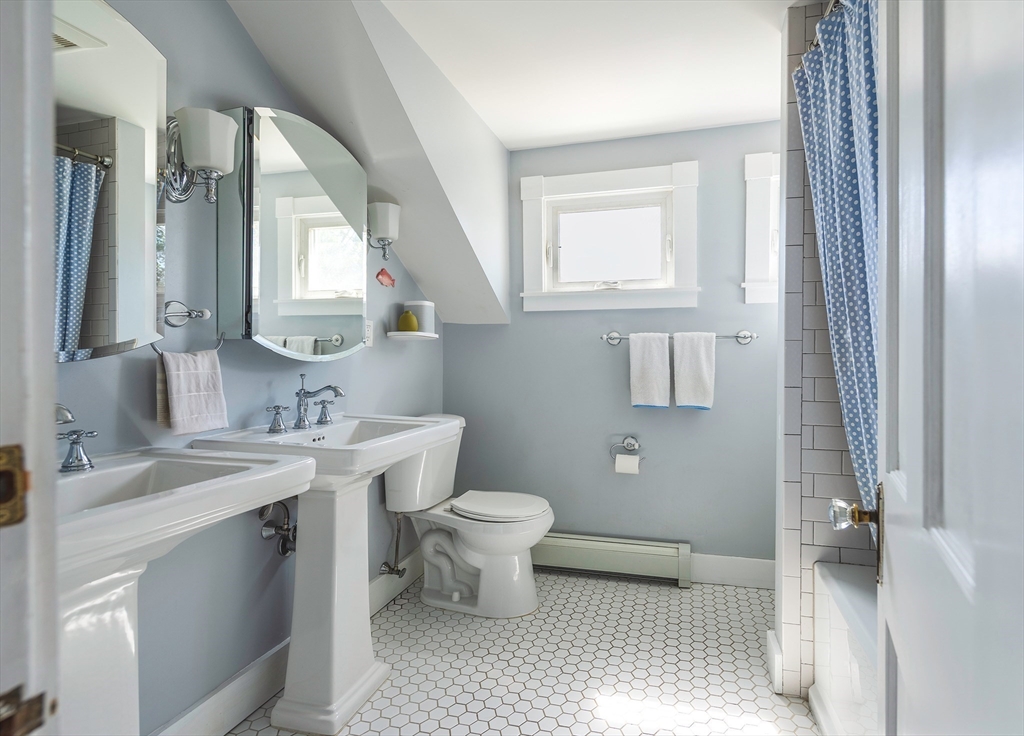 30 Paradise Road Swampscott, MA 01907 - Photo 17 of 24 a bathroom with a toilet sink and mirror