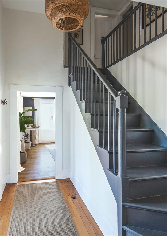 30 Paradise Road Swampscott, MA 01907 - Photo 2 of 24 a view of staircase and living room with wooden floor and a rug