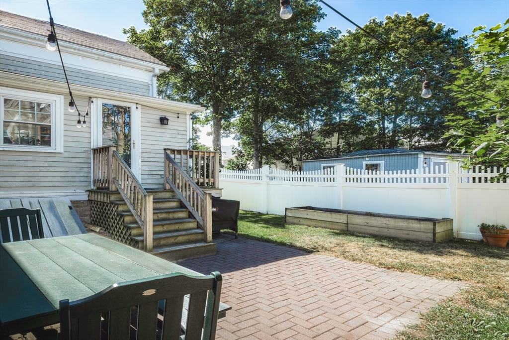 30 Paradise Road Swampscott, MA 01907 - Photo 21 of 24 a backyard of a house with barbeque oven table and chairs