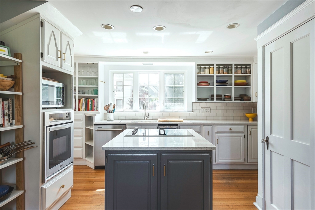 30 Paradise Road Swampscott, MA 01907 - Photo 6 of 24 a kitchen with a stove a sink and a refrigerator