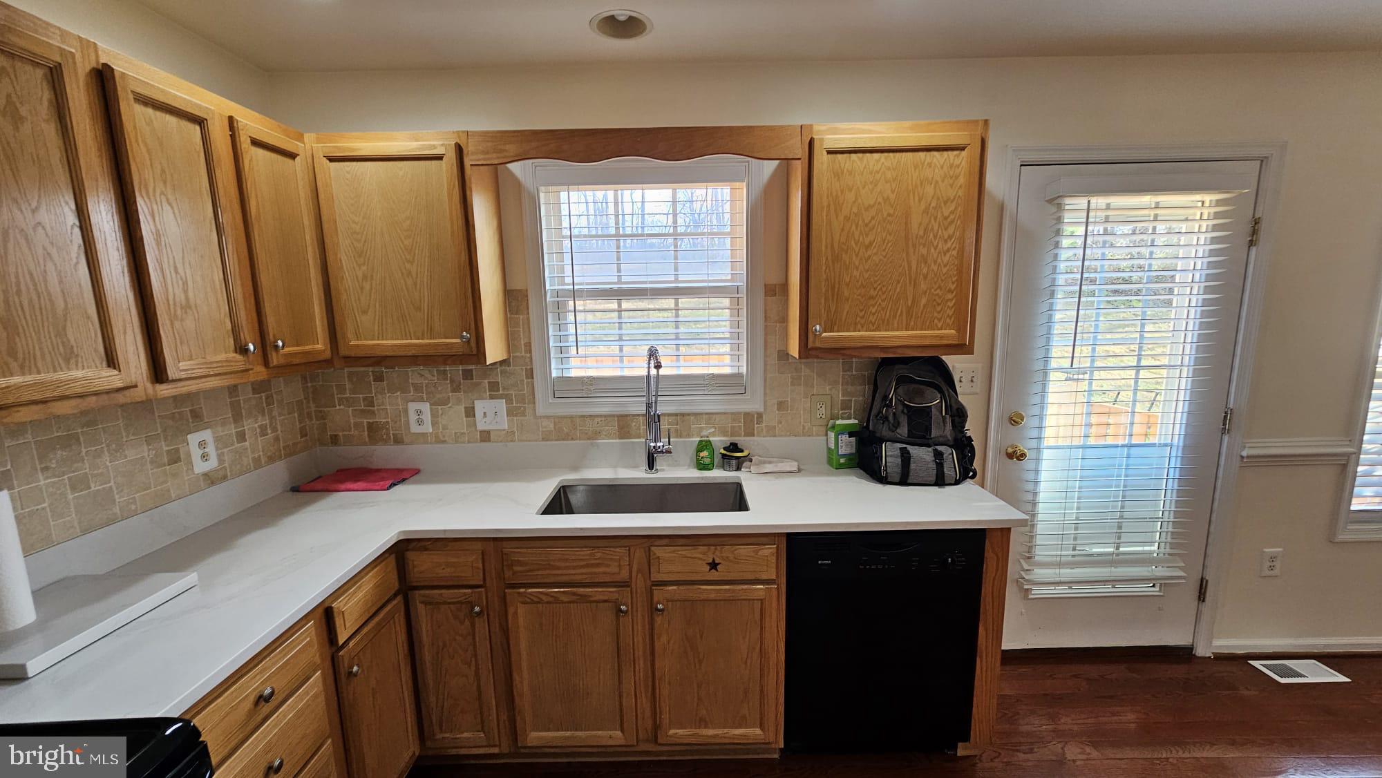 201 Eastside Lane Winchester, VA 22602 - Photo 13 of 21 a kitchen with a sink stove and cabinets