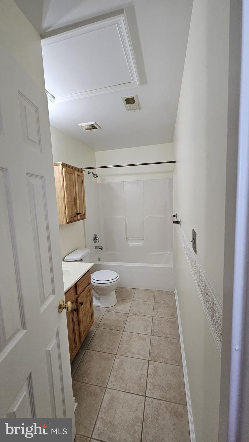 201 Eastside Lane Winchester, VA 22602 - Photo 14 of 21 a bathroom with a sink a toilet and shower