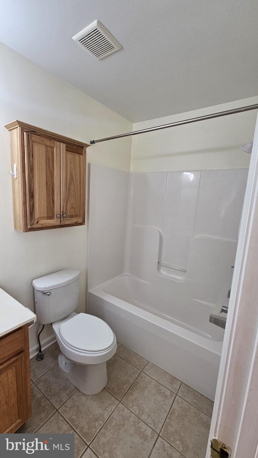 201 Eastside Lane Winchester, VA 22602 - Photo 18 of 21 a bathroom with a toilet and a shower