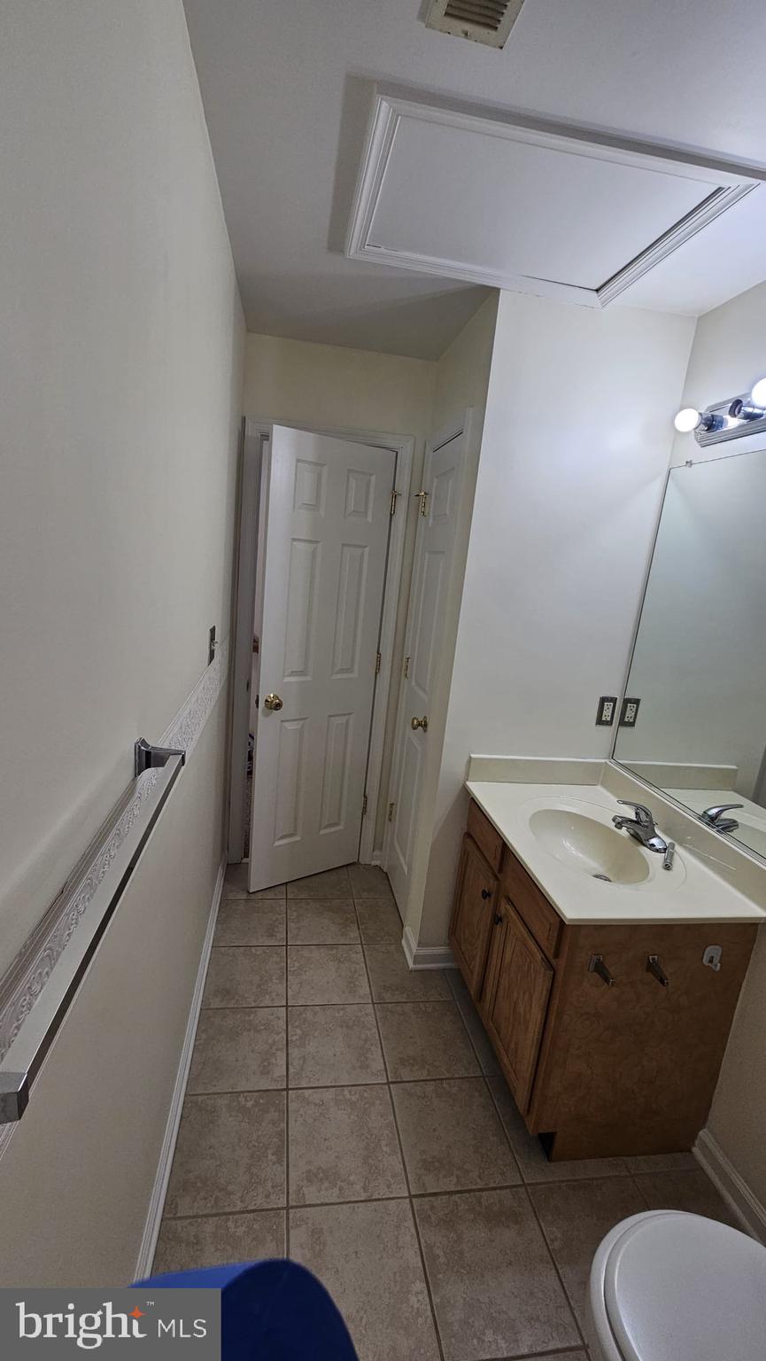 201 Eastside Lane Winchester, VA 22602 - Photo 10 of 21 a bathroom with a sink and a mirror