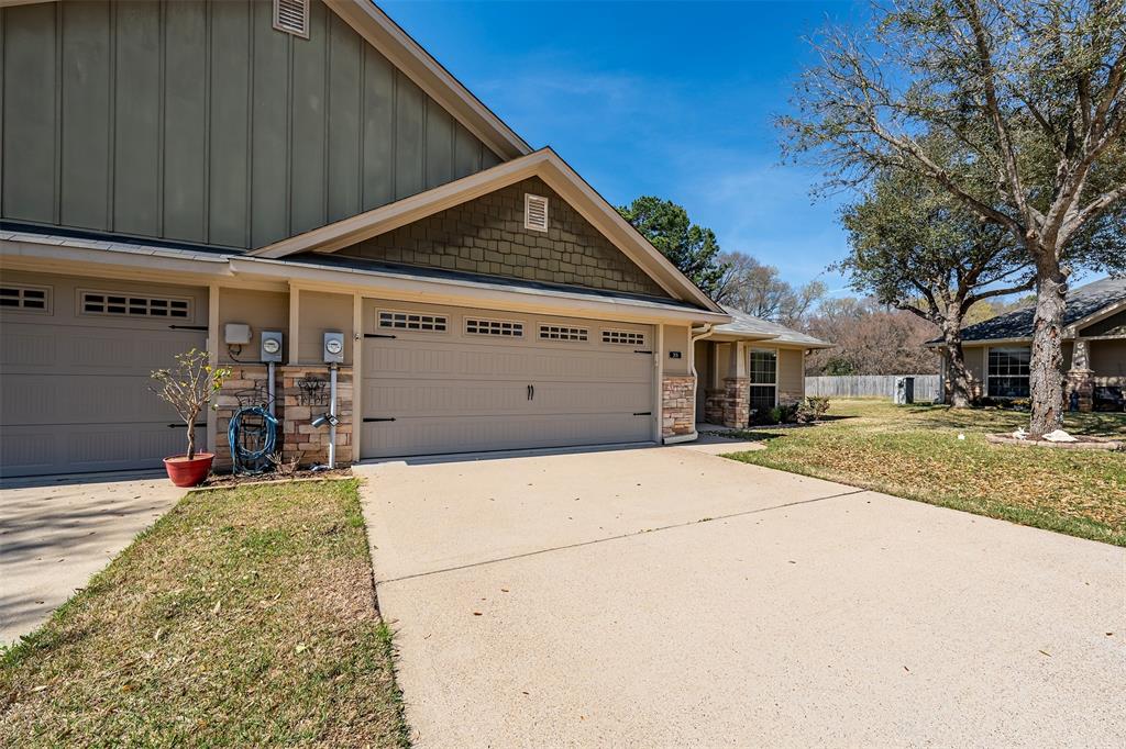 421 West Cumberland Road, Unit 205 Tyler, TX 75703 - Photo 2 of 24 a view of a house with a garage