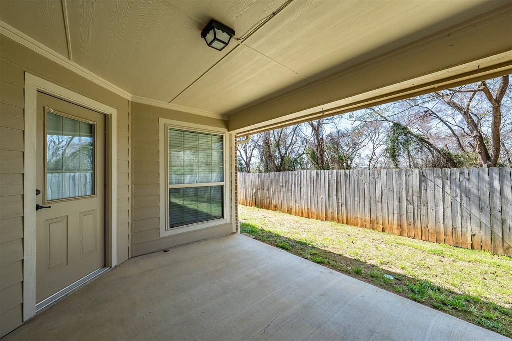 421 West Cumberland Road, Unit 205 Tyler, TX 75703 - Photo 22 of 24 a view of outdoor space with wooden fence