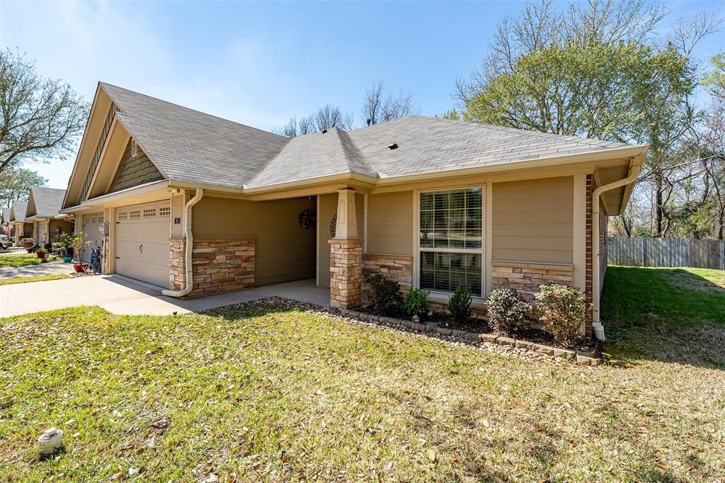 421 West Cumberland Road, Unit 205 Tyler, TX 75703 - Photo 3 of 24 a view of a house with backyard and garden