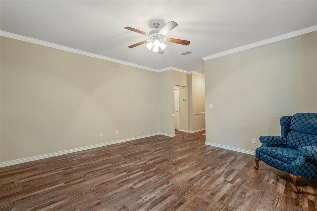 421 West Cumberland Road, Unit 205 Tyler, TX 75703 - Photo 8 of 24 a view of livingroom with hardwood floor and ceiling fan