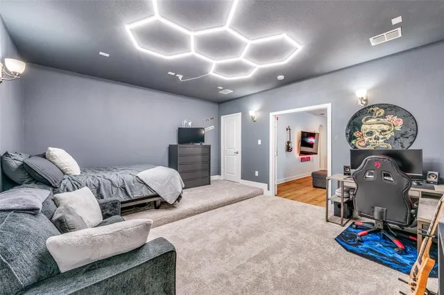 a bedroom with furniture and a chandelier
