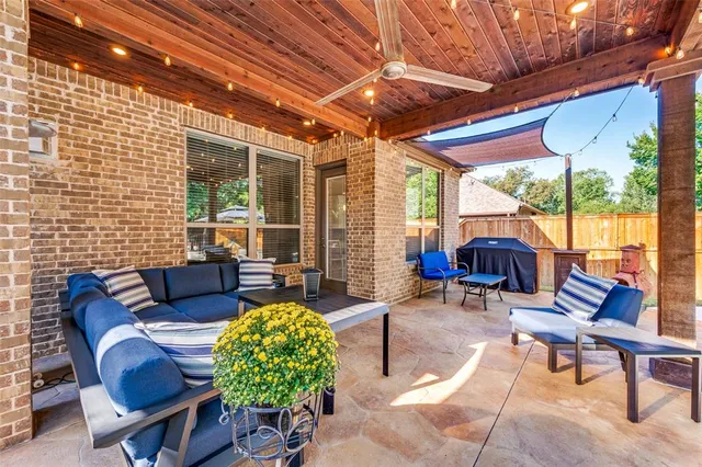 a outdoor living space with furniture and garden view