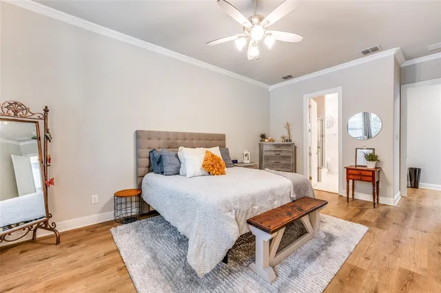 a bedroom with a bed a table and chair