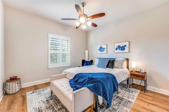 a bed room with a bed and a chair